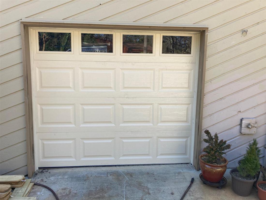 Classic cream garage door with window inserts