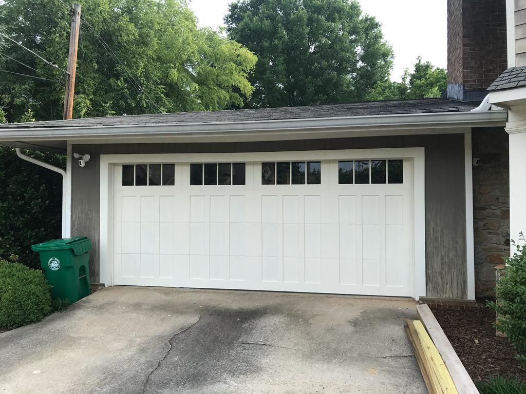 New white carriage-style garage door installation