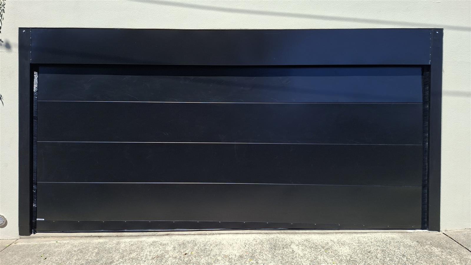 Sleek modern flush-panel custom garage door